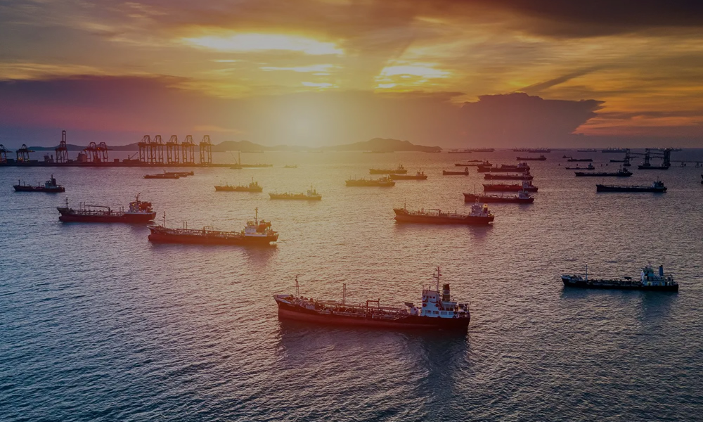 Ships anchored at sunset harbor